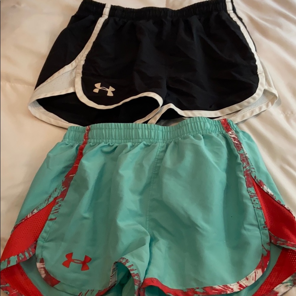 Two pairs of under armor shorts.